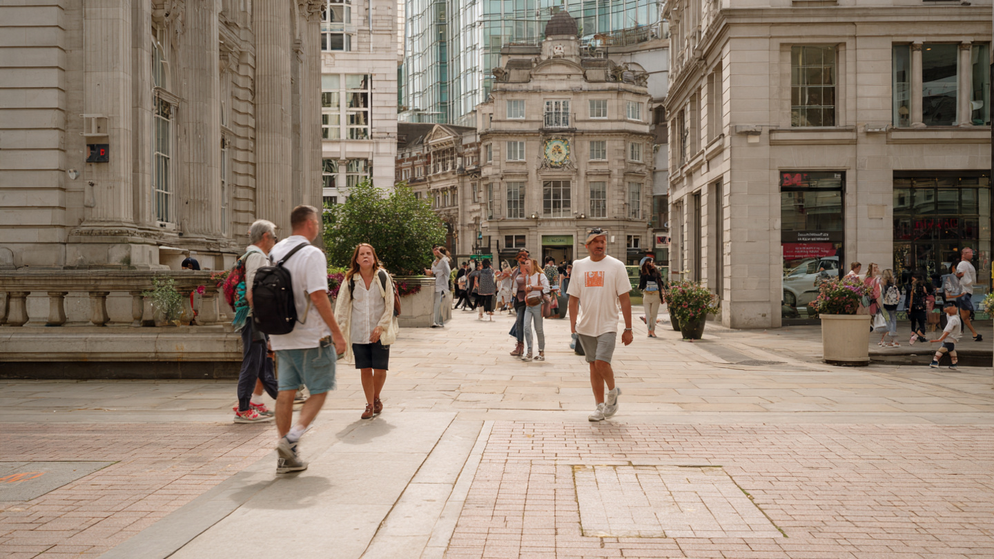 Open pedestrian plaza in central London with historic buildings and people walking, highlighting things to do near London city center and nearby walkable sightseeing areas.