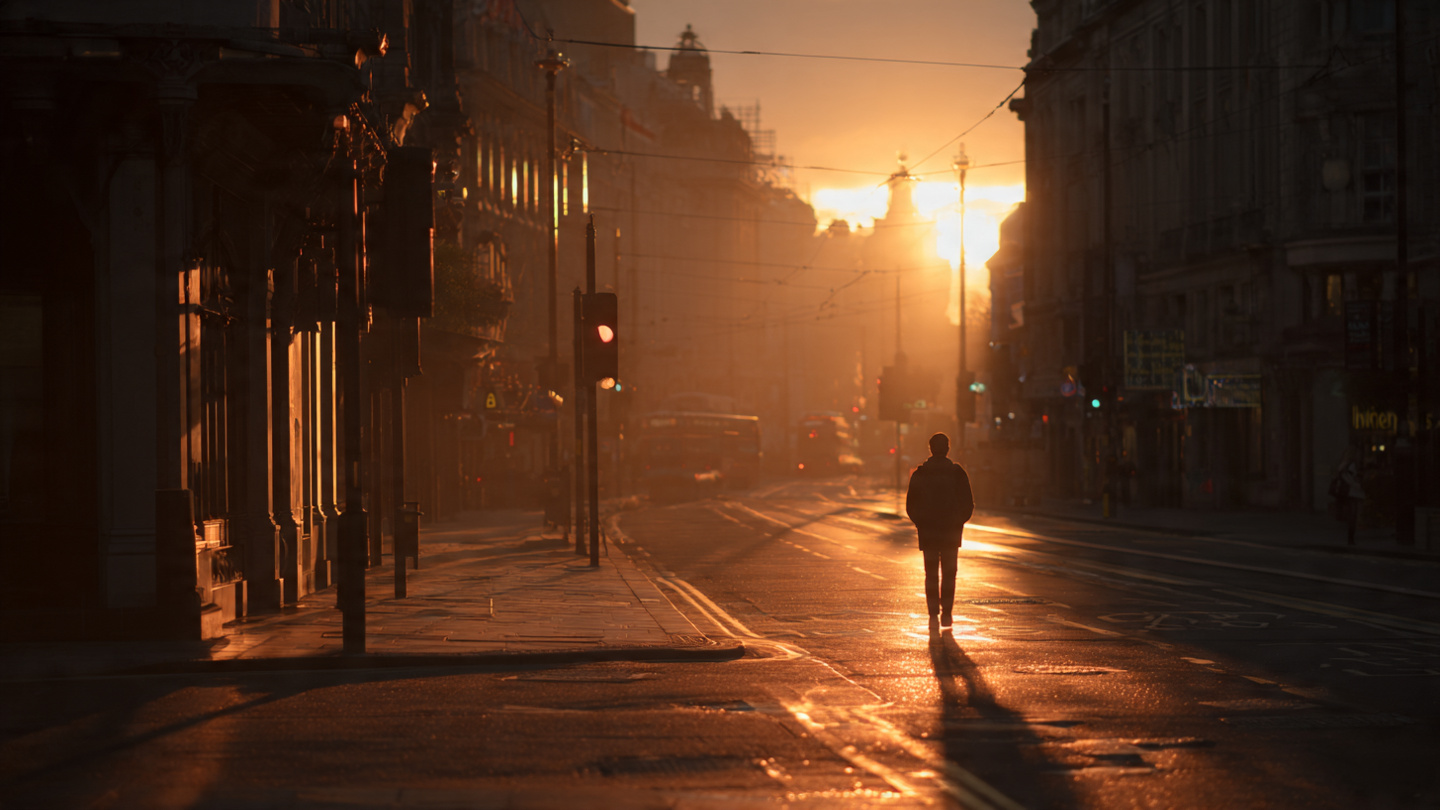 Calm early morning London street at sunrise with a lone traveler walking through the city, reflecting one day in London things to do, slow sightseeing, and meaningful London travel experiences.