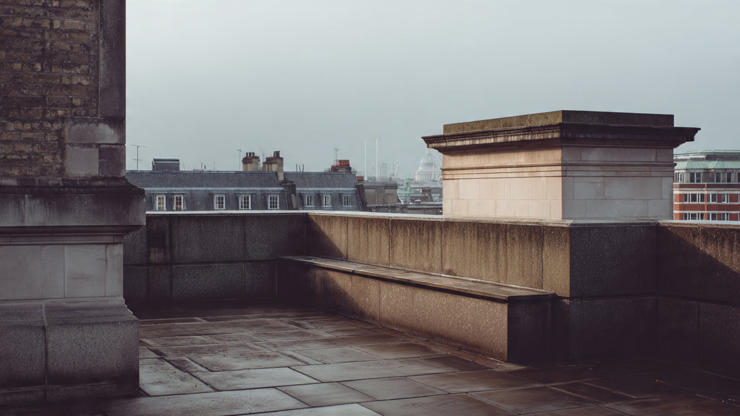 Hidden viewpoints in London from a quiet rooftop-style terrace with stone walls and distant historic rooftops, capturing a subtle secret viewpoint and peaceful architectural outlook over the London skyline.