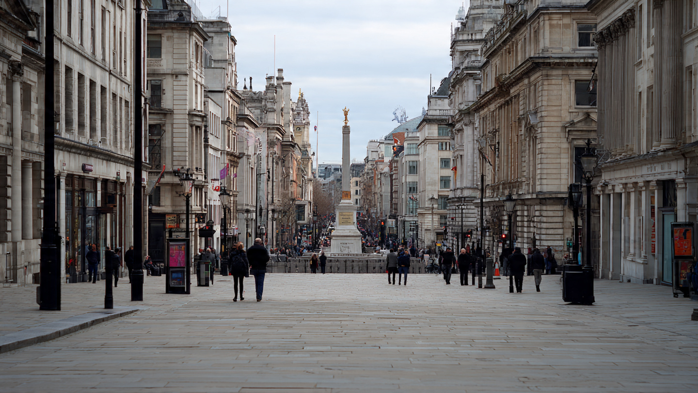 Wide pedestrian street leading toward Trafalgar Square in central London, highlighting one day in London things to do, city walking routes, and classic London sightseeing experiences.