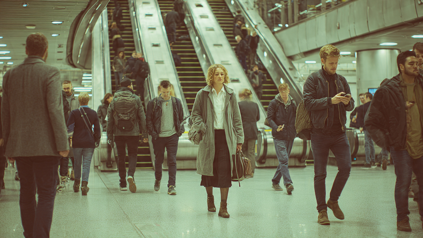 Commuters walking through a London Underground station during a 3 day London itinerary, showing how travelers move through the city on a short London trip
