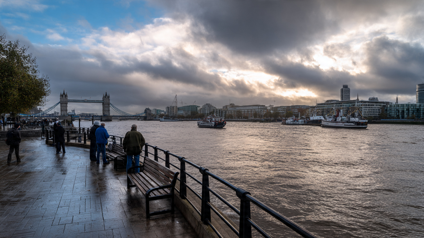 Riverside walk along the Thames with views of Tower Bridge, showing one of the best things to do near Tower Bridge, including scenic walks, sightseeing, and relaxing river views in London