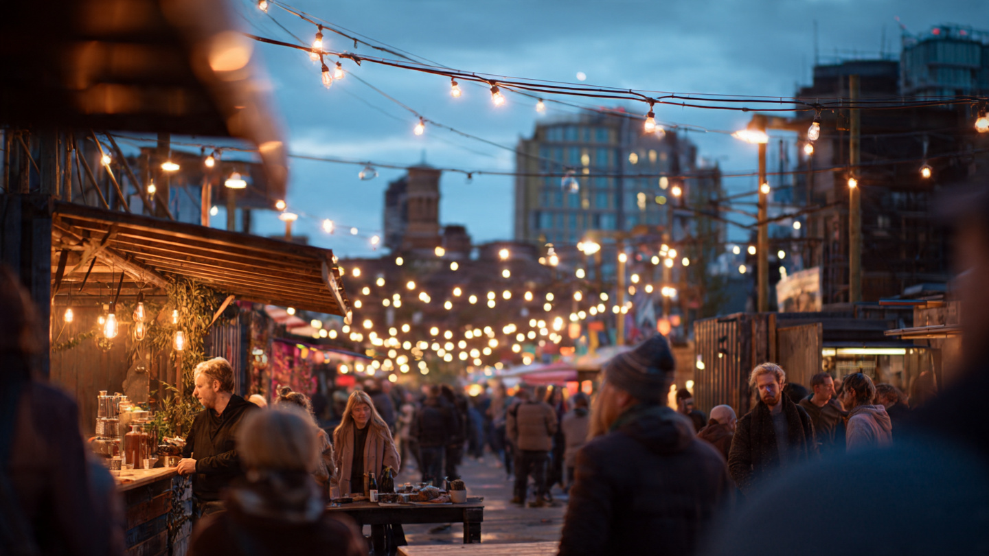 London markets at night with string lights, evening food stalls, and people enjoying a seasonal outdoor market atmosphere