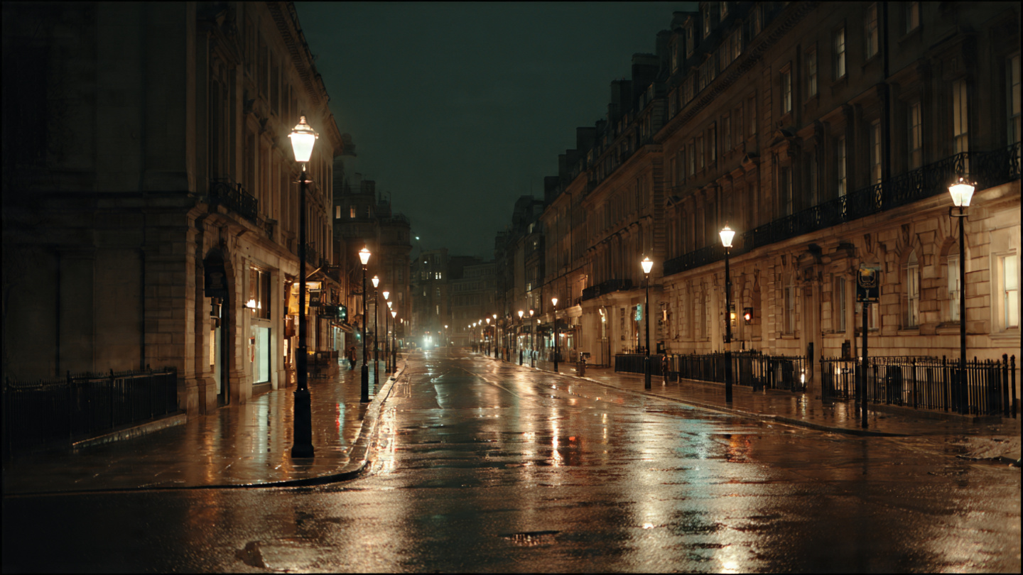 Things to do in London in winter with quiet nighttime streets, glowing streetlights, and reflective pavements after rain